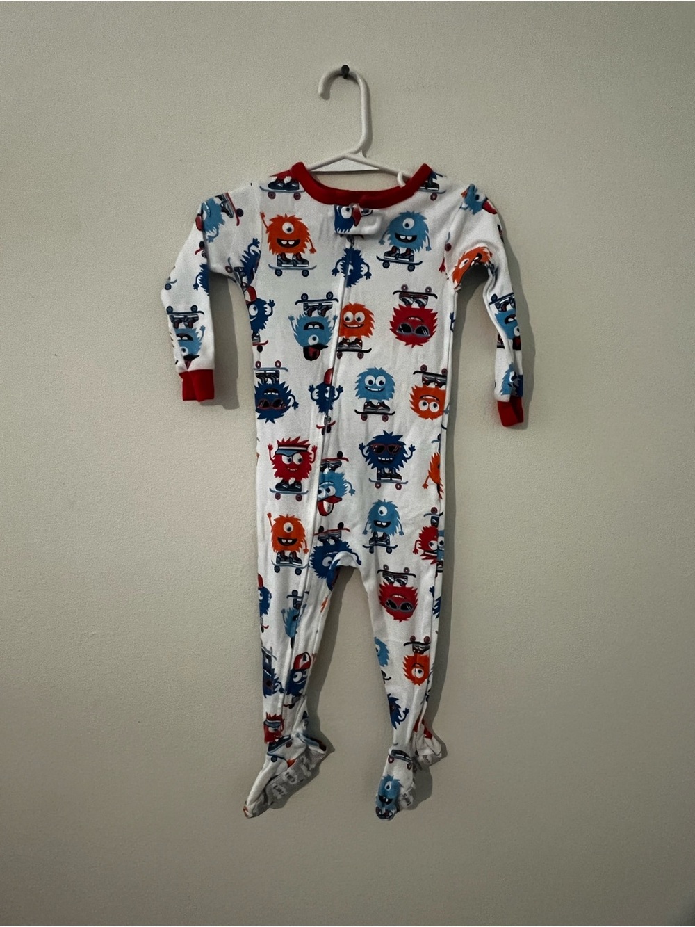 Carter's White Footed One-Piece Pajamas with Red Trim and Blue & Orange Monsters